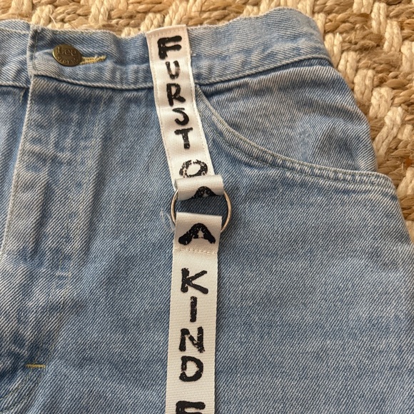 High-Rise Light Blue Denim Shorts with Graphic Strap Detail - Picture 2 of 4